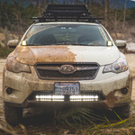 clear 30 inch led light bar mounted on a subaru 